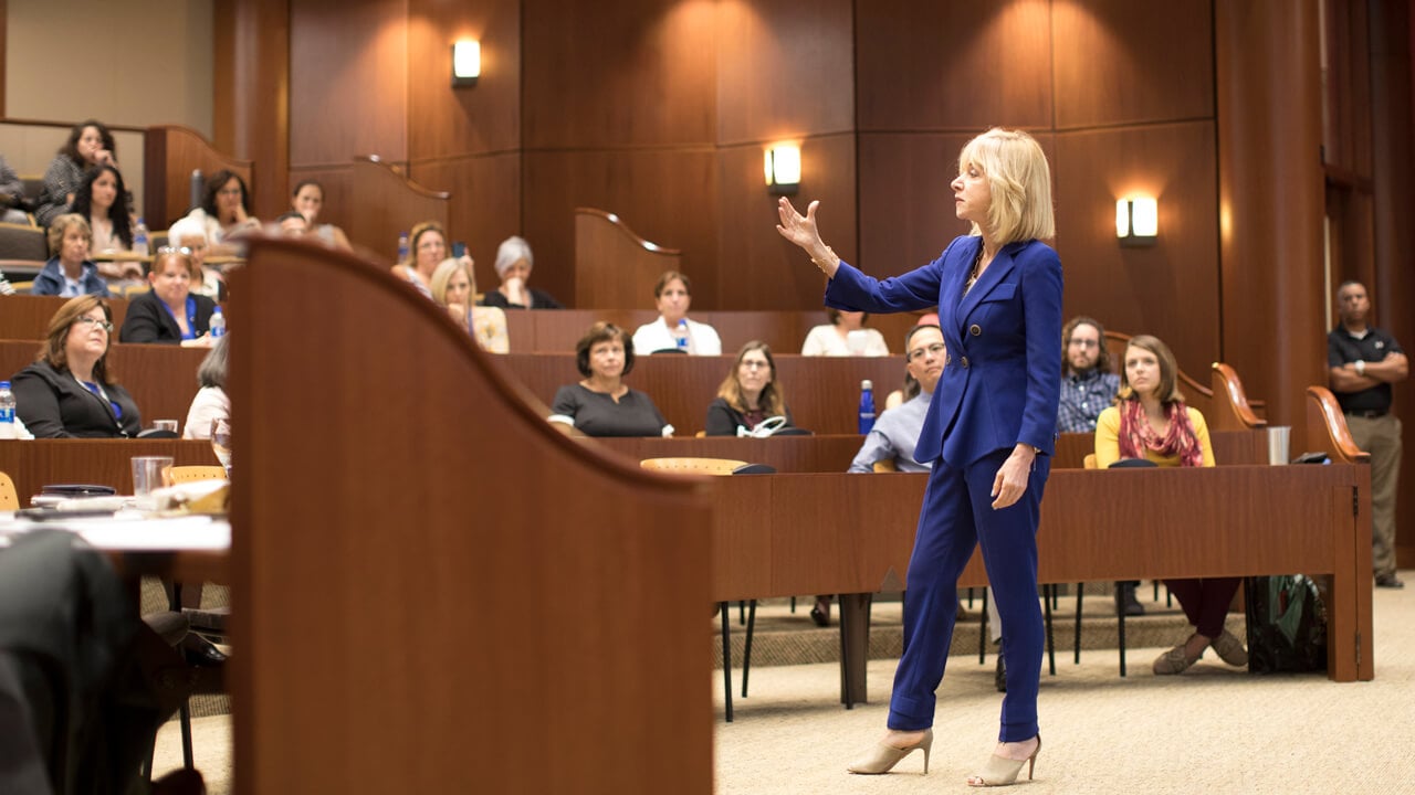 Judy Olian talks to a crowd