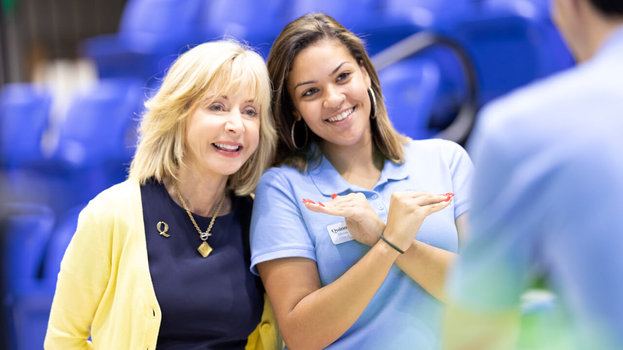 Judy Olian poses with a student