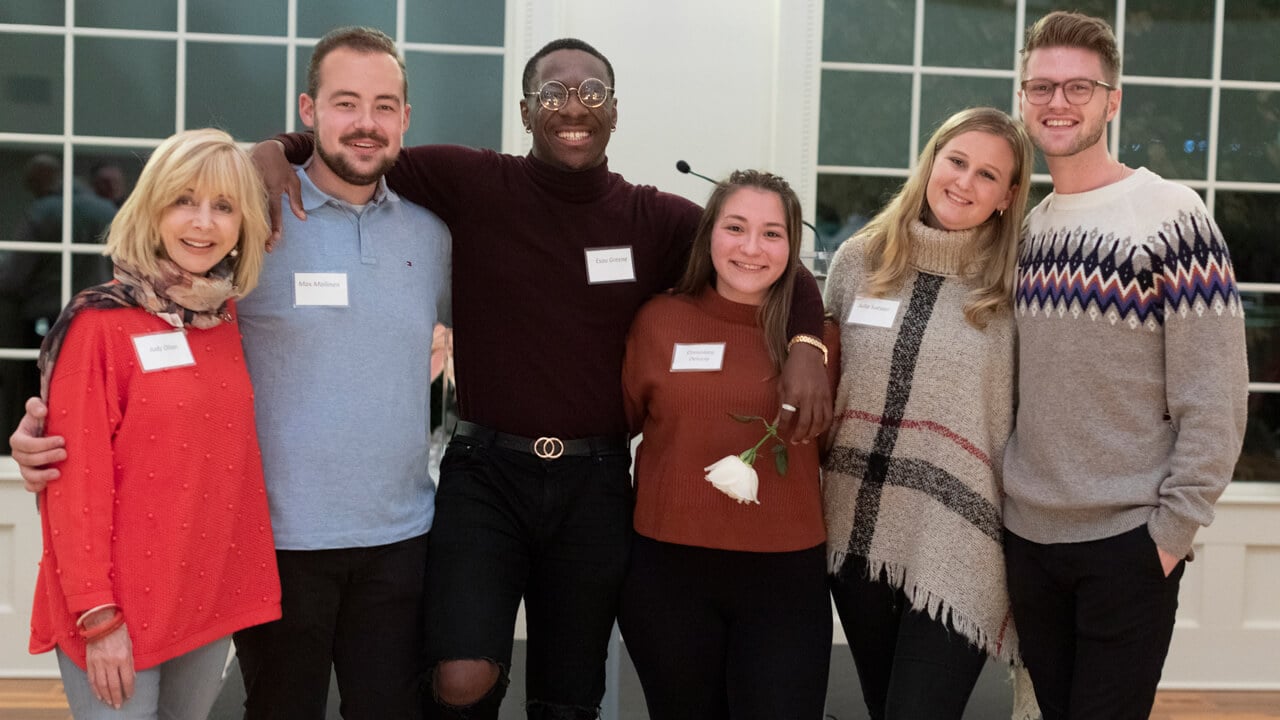 Judy Olian poses for a group photo