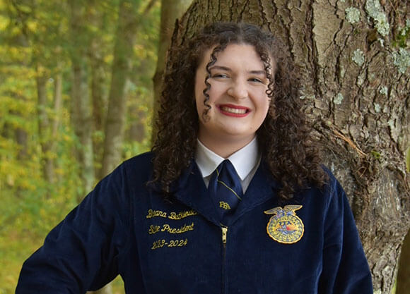 Breana Butkievich smiles in her FFA President jacket