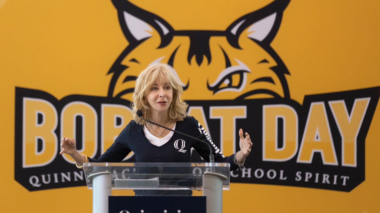 Judy Olian speaks at a podium