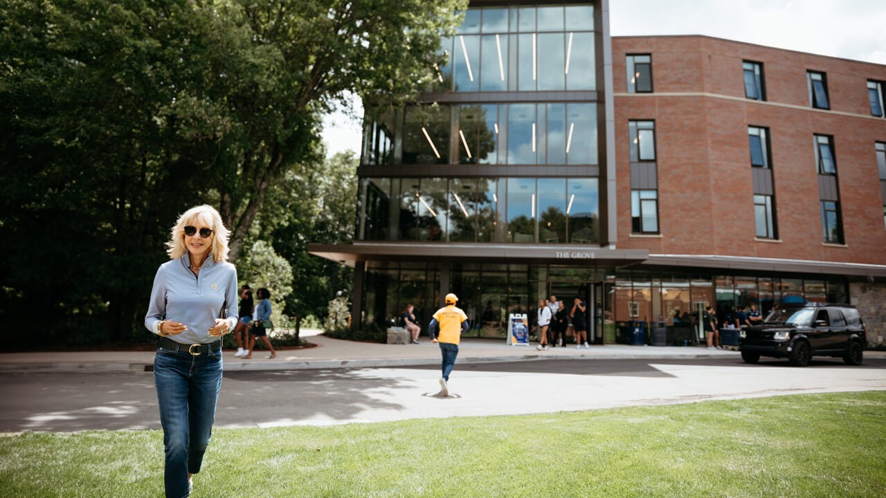 Judy Olian walking in front of The Grove
