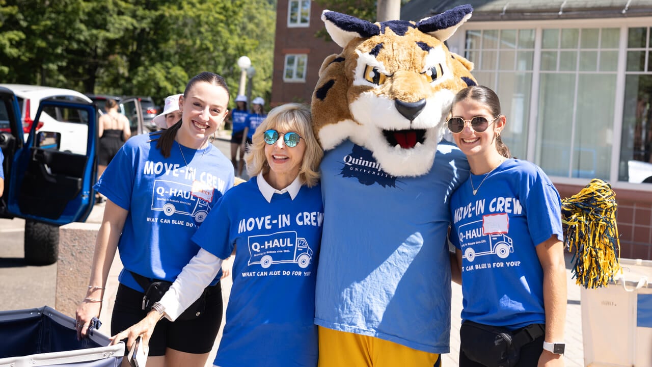 Judy Olian poses with Boomer