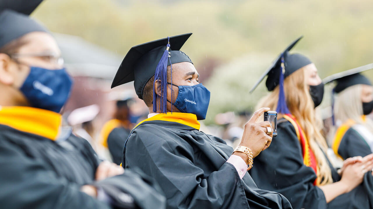 Nursing graduate recording commencement ceremony