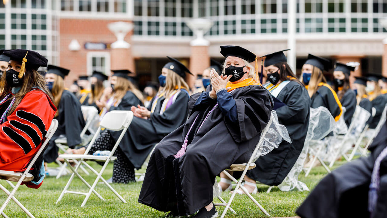 Nursing graduates clapping at commencement ceremony