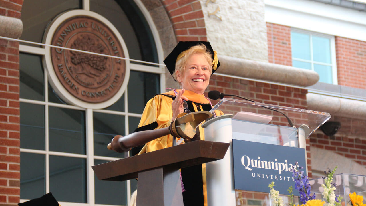 Beth Beckman delivers her keynote address from the podium