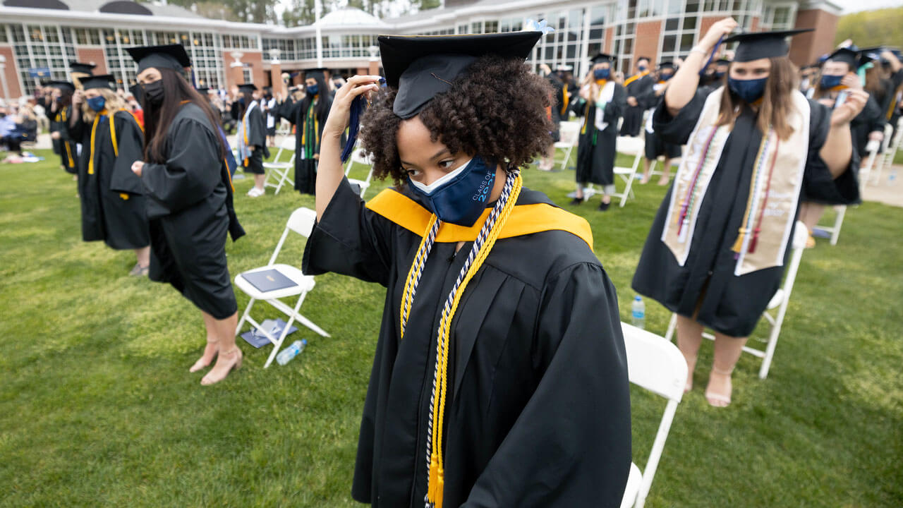 Students get ready to throw their caps