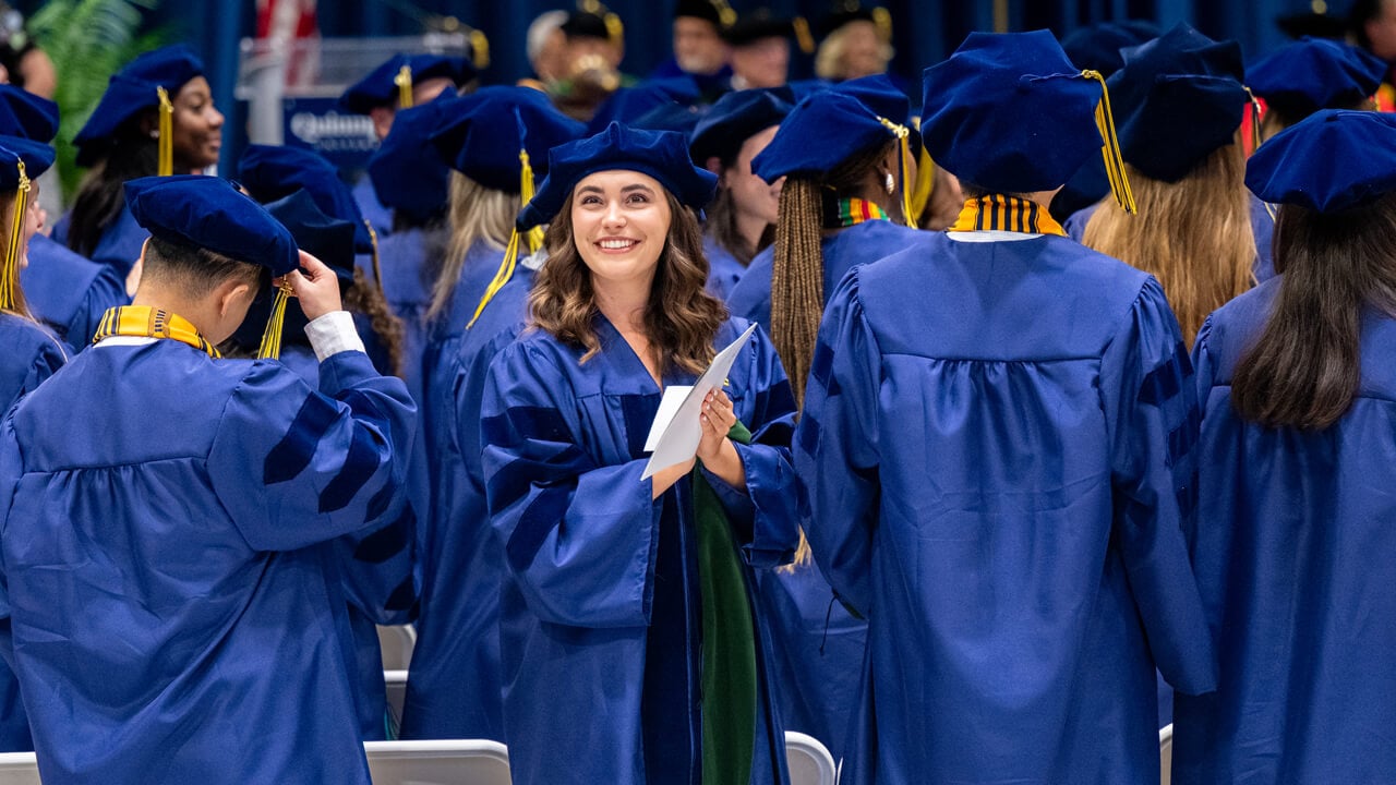 Graduate looks into the crowd