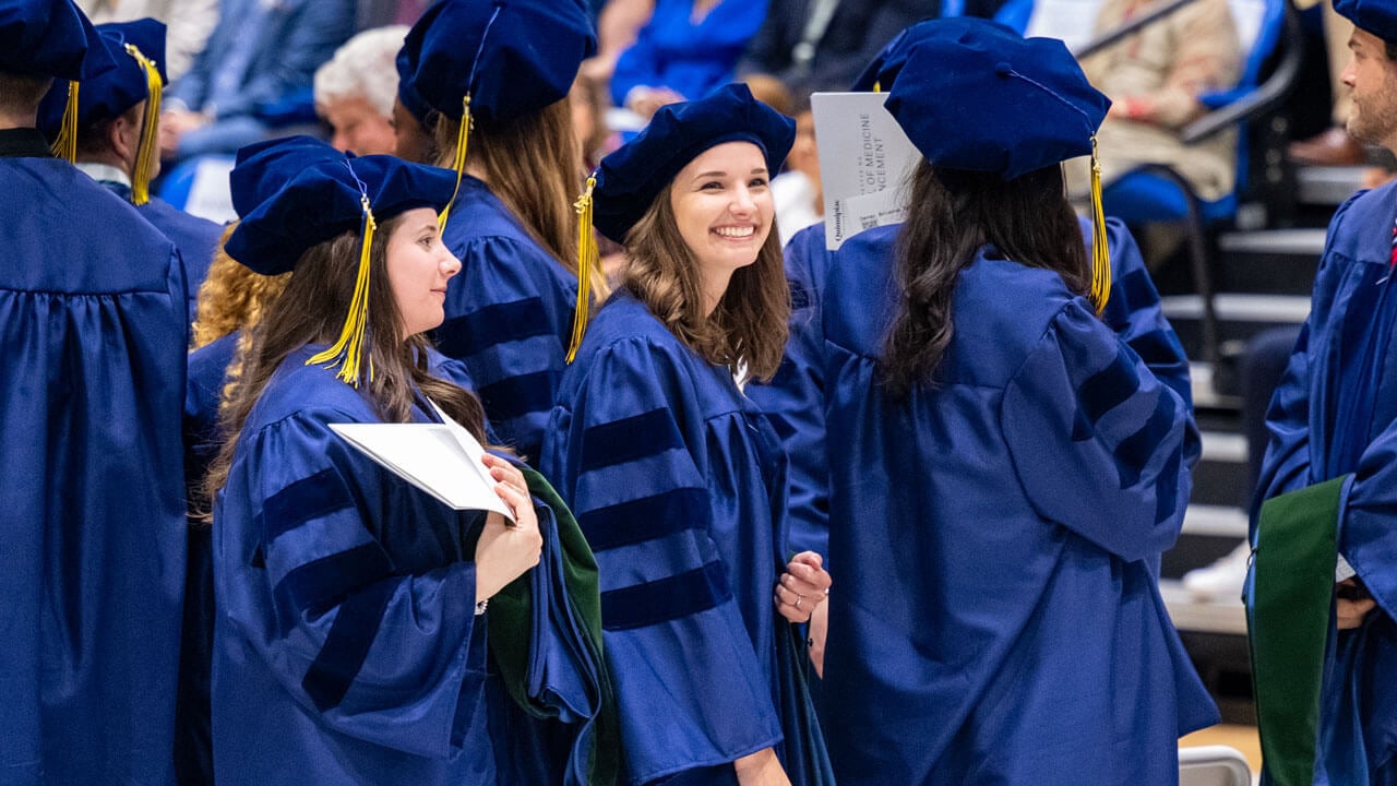 Graduate smiles into crowd