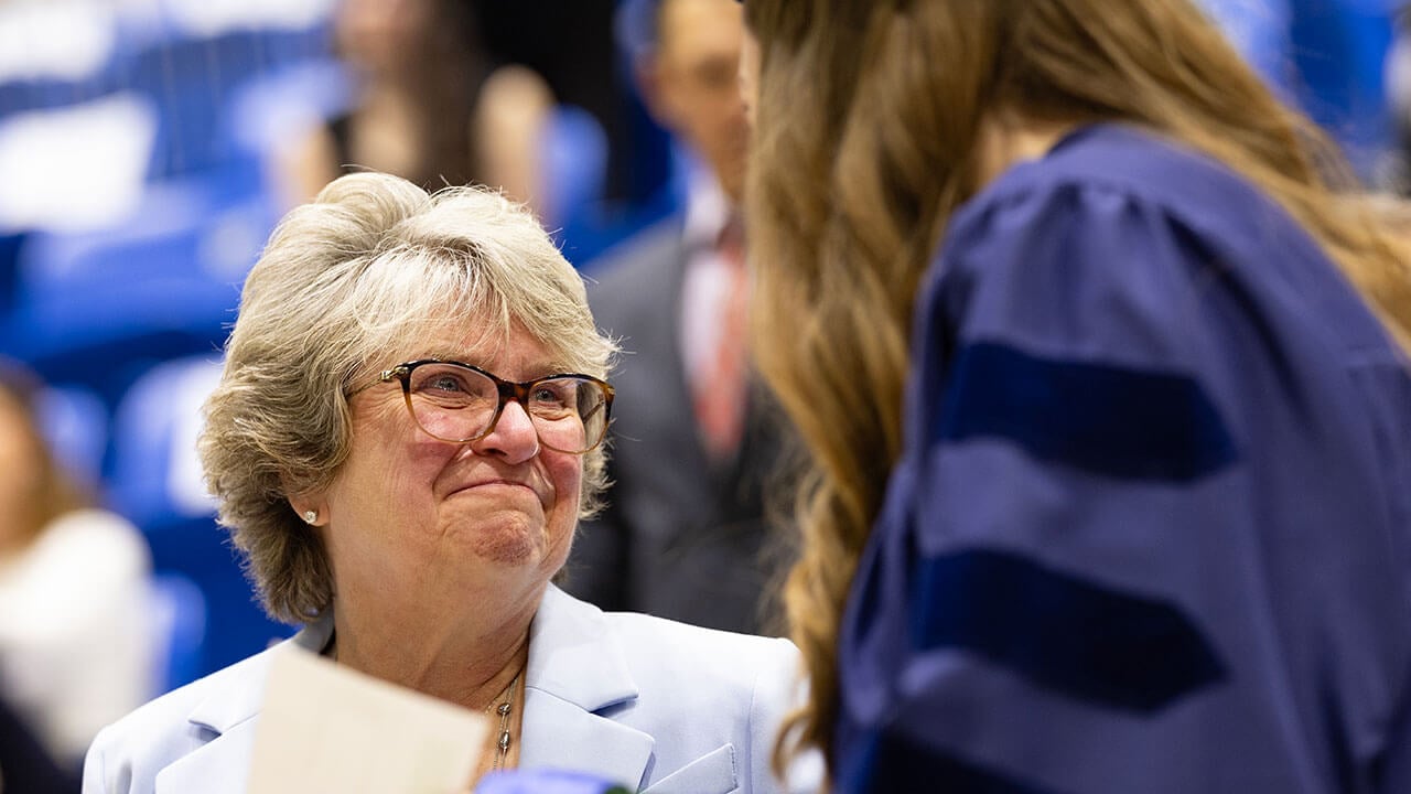 loved one smiles at graduate