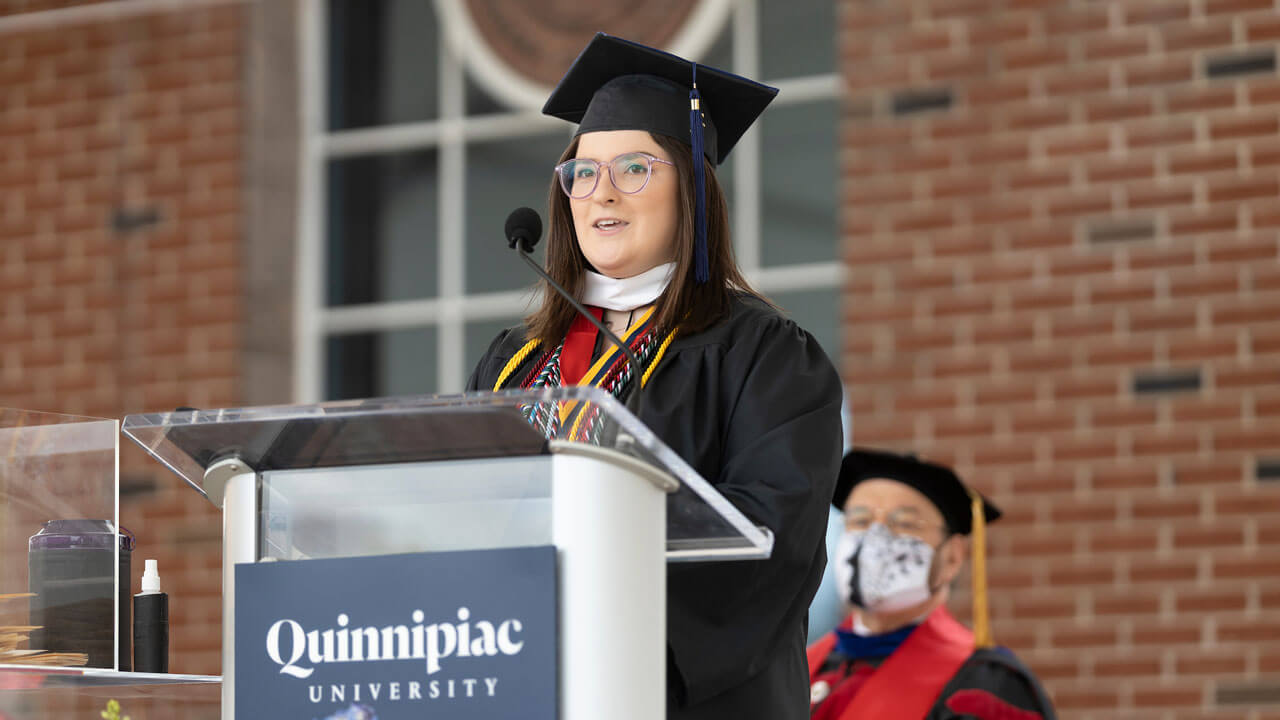 Anna Ciacciarella speaks to fellow graduates at the Commencement podium