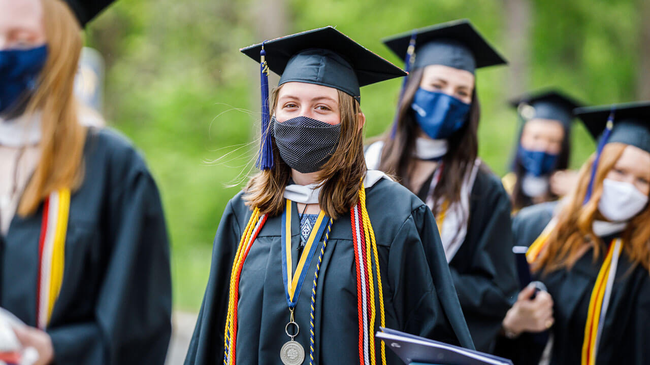 Student looking at camera while in line