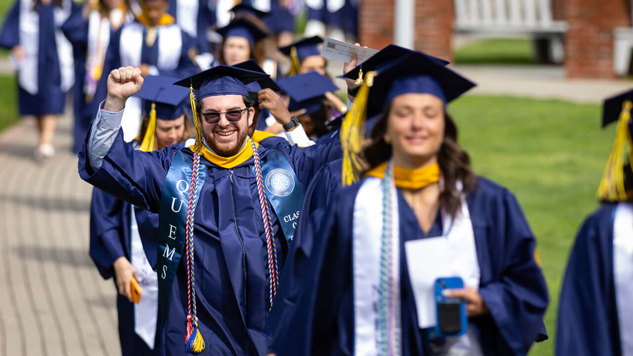 Graduate cheers in procession