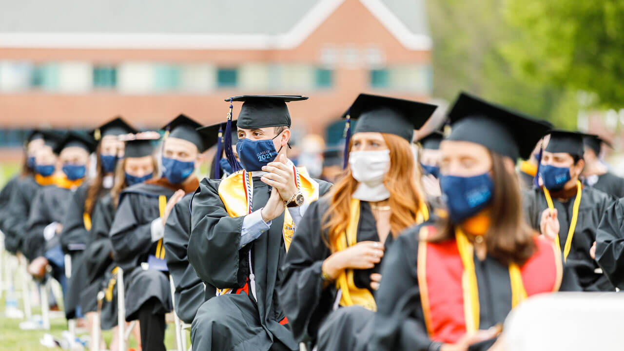 Students clapping during commencement ceremony