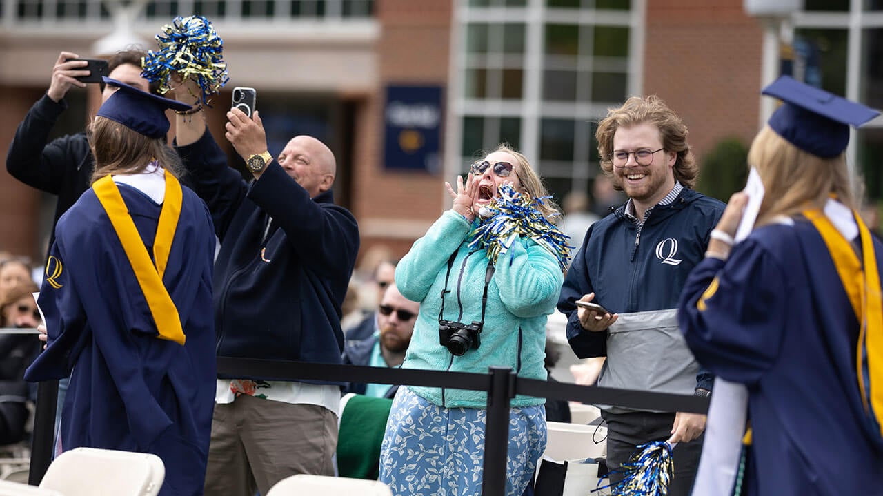 loved ones cheer with pompoms