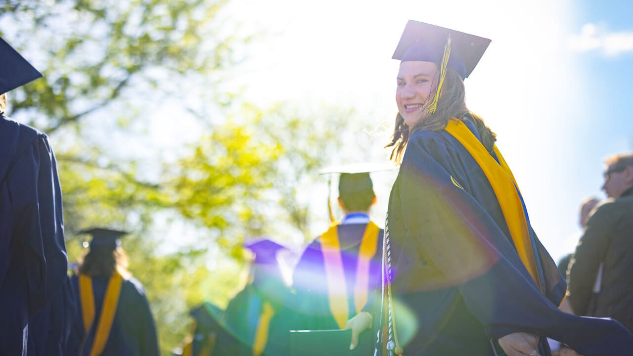 Jackie Ydrovo processes into commencement.