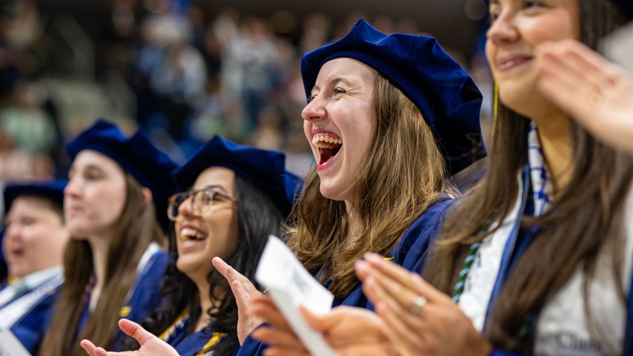 Graduate claps and cheers for speech
