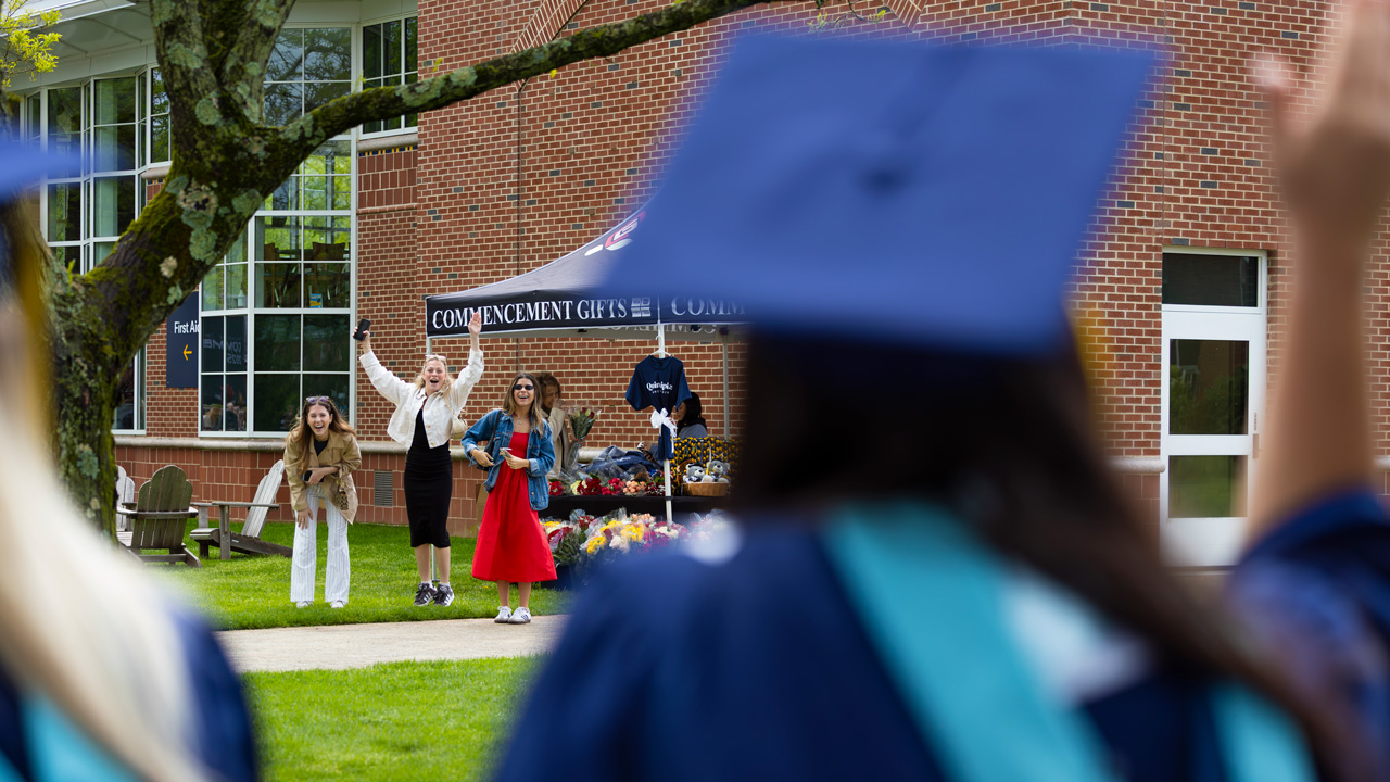 3 family members cheering outside
