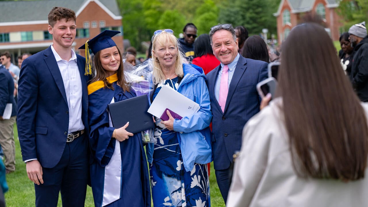 Graduate and loved ones pose for a picture