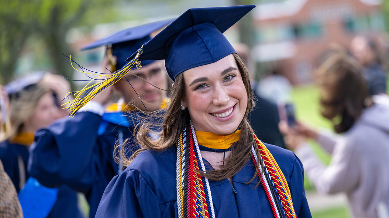 Madison Fahlborg smiles while processing