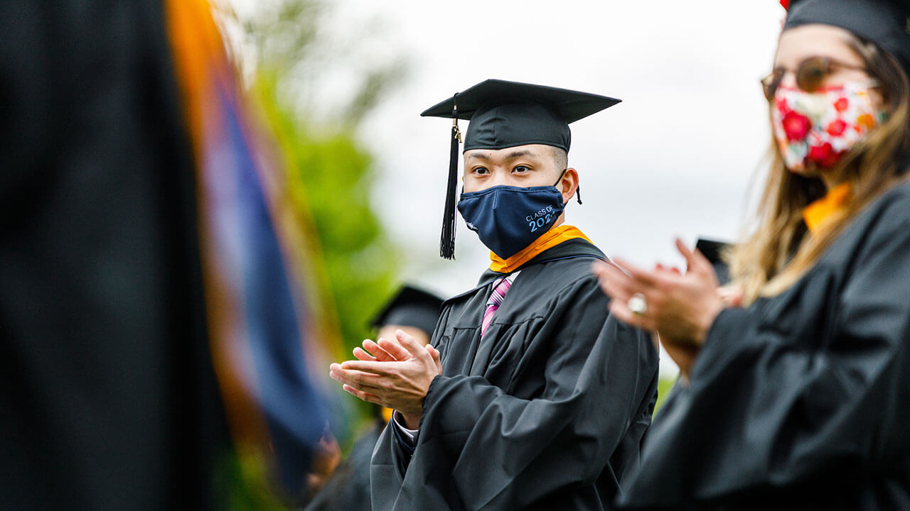 Students clapping at commencement ceremony