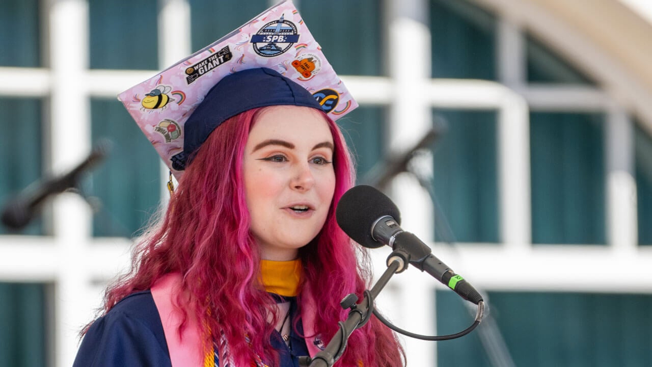 Jennifer Dorothy Moglia '25 addresses graduates from the podium.
