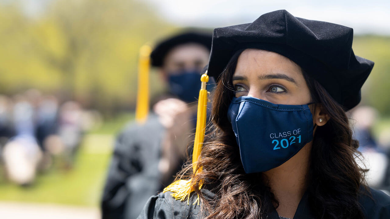 Medical school graduates watching commencement ceremony