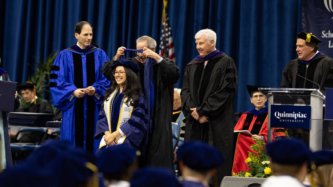 Elated Graduate gets hooded