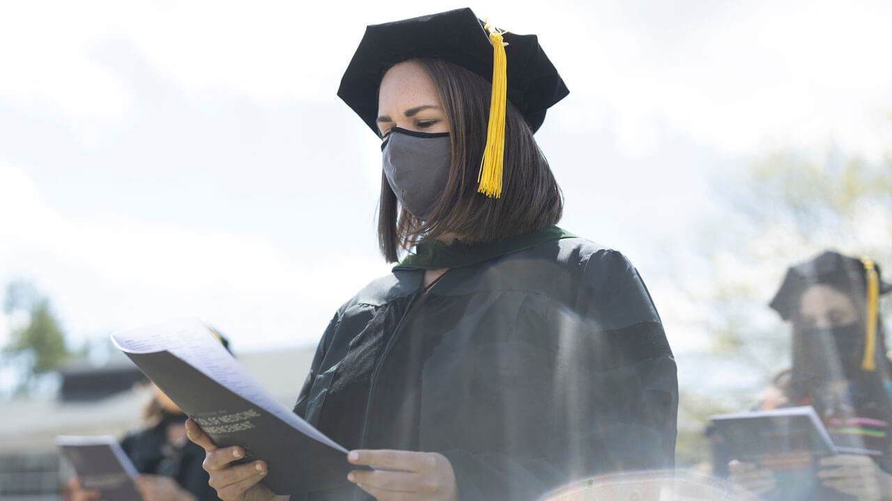 School of medicine graduate reading the hippocratic oath