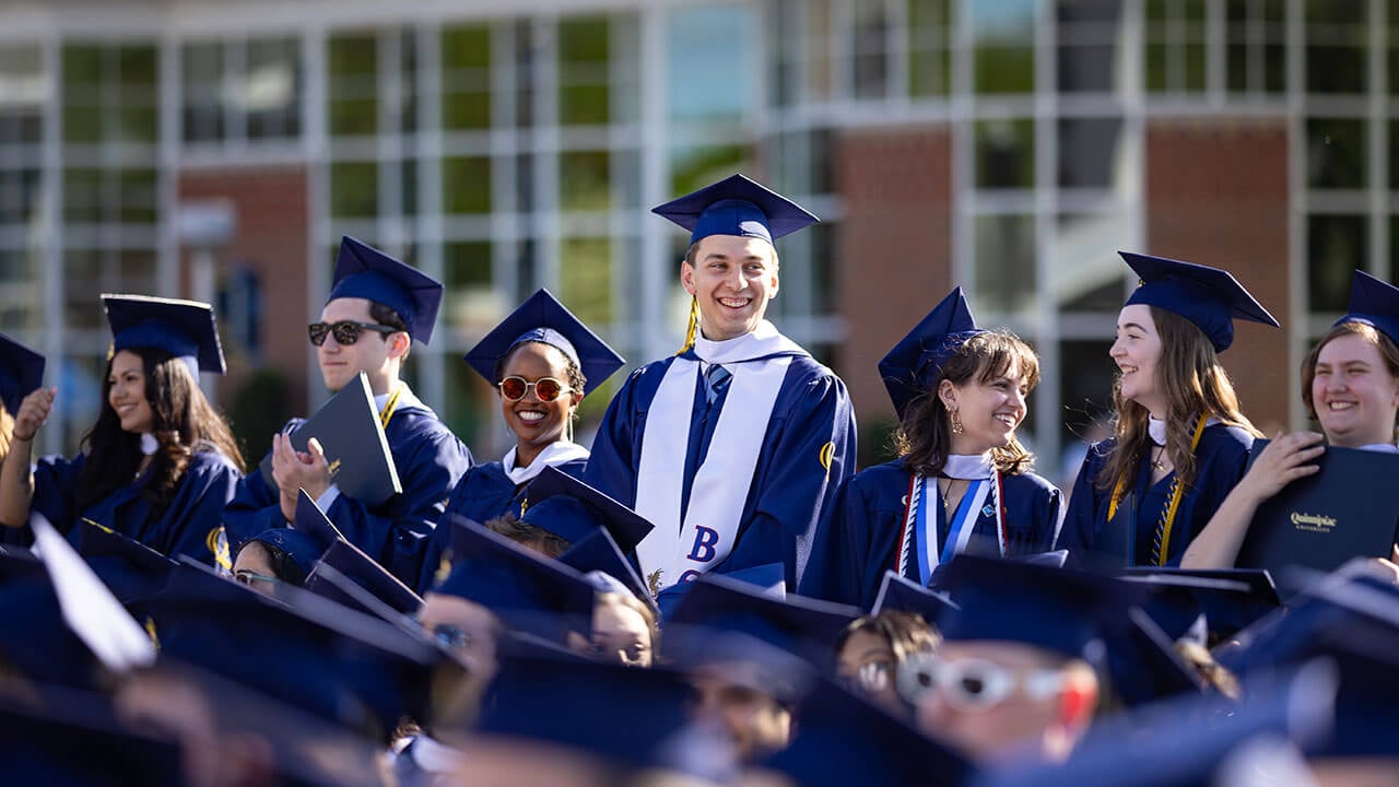 A group of graduates smiling