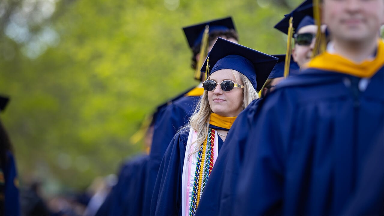 Student in sunglasses at commencement.