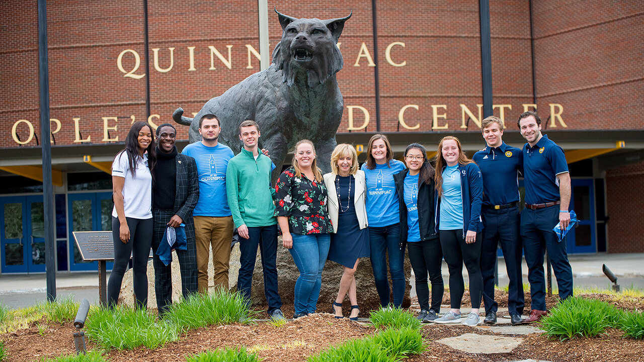 Students stand with President Olian.