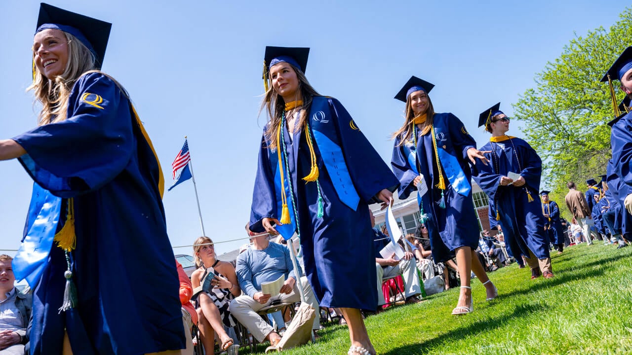 Graduates process into graduation.