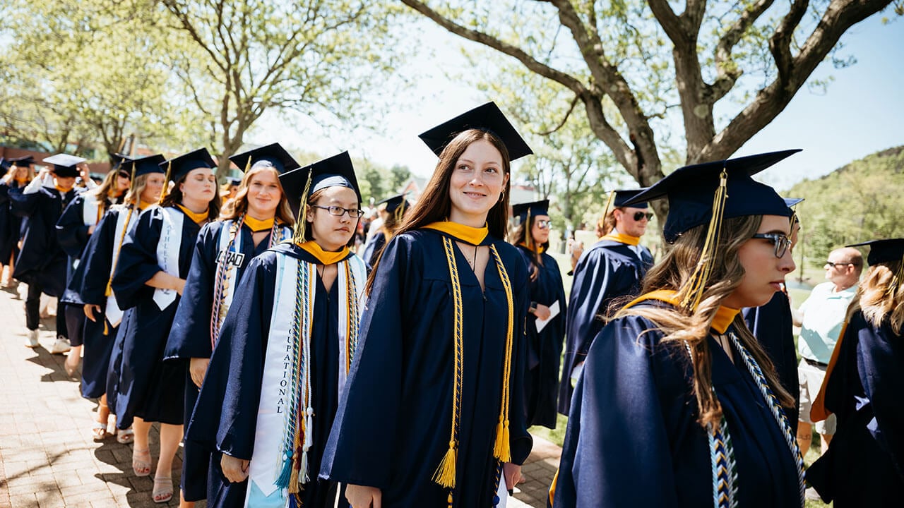 Grads processing onto the quad