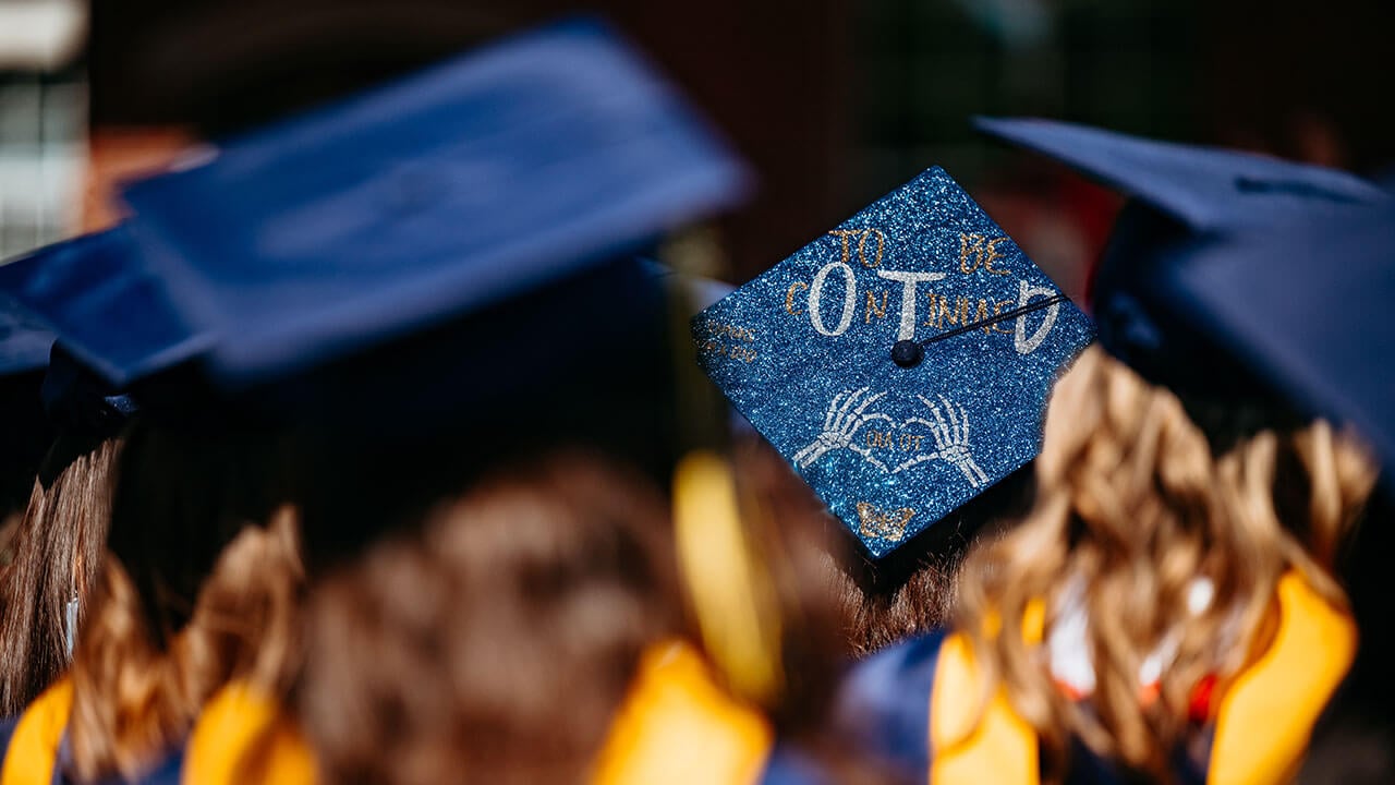 A grad cap that says "To be continued" with the OTD large