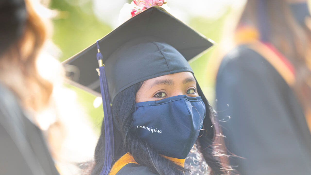 Graduate looking into camera