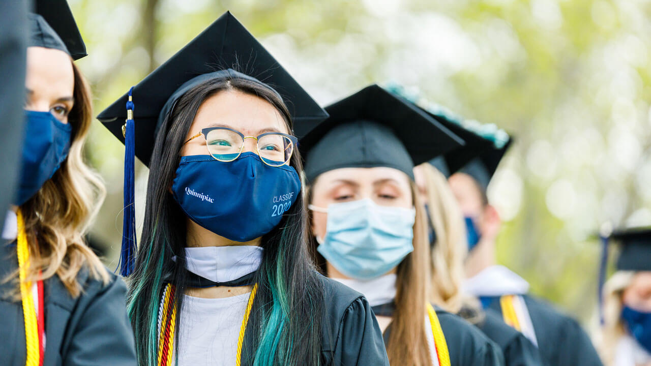 Graduates walking into commencement ceremony
