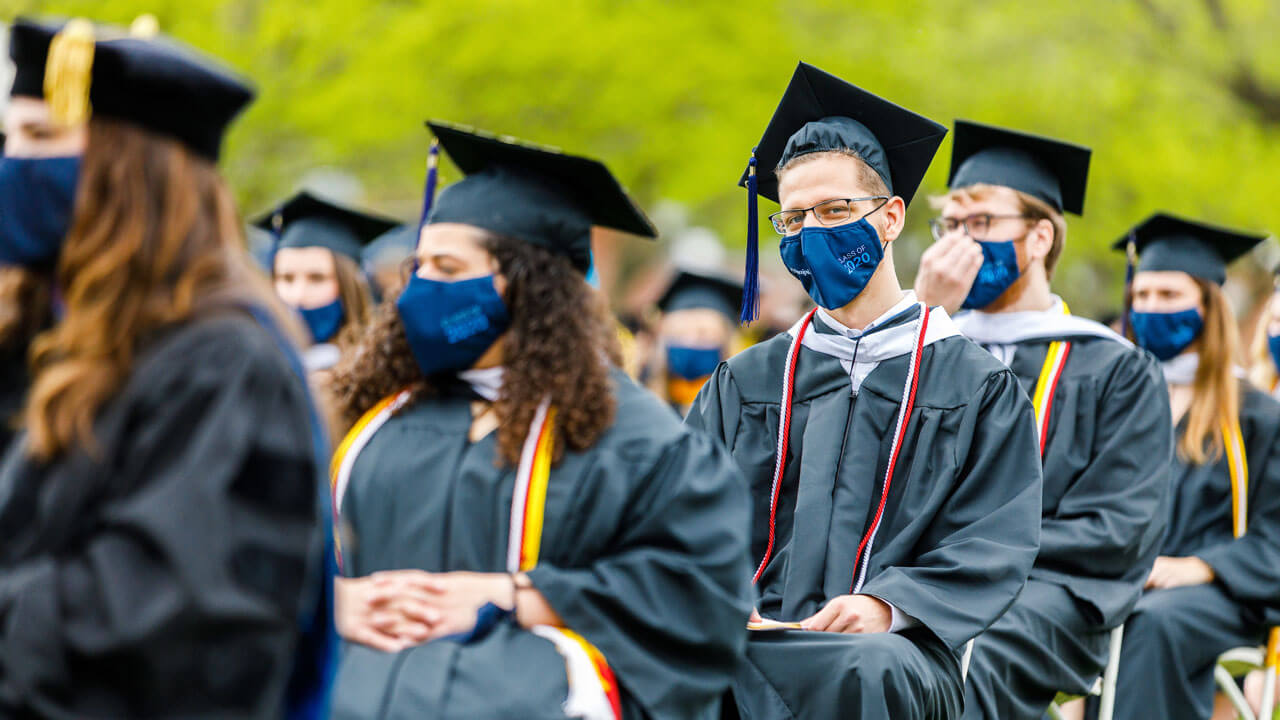 Graduates sitting down at commencement ceremony
