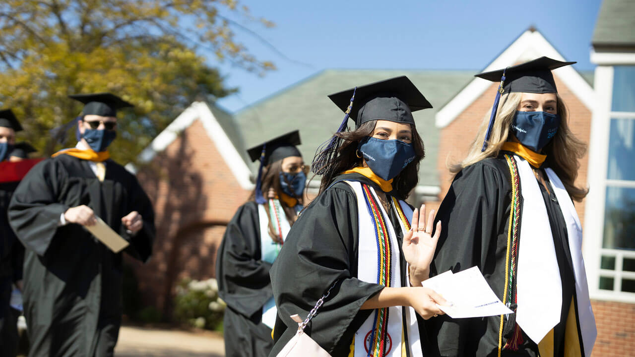2020 students standing next to Buckman center