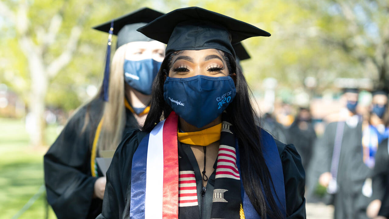 Graduates walking into commencement ceremony