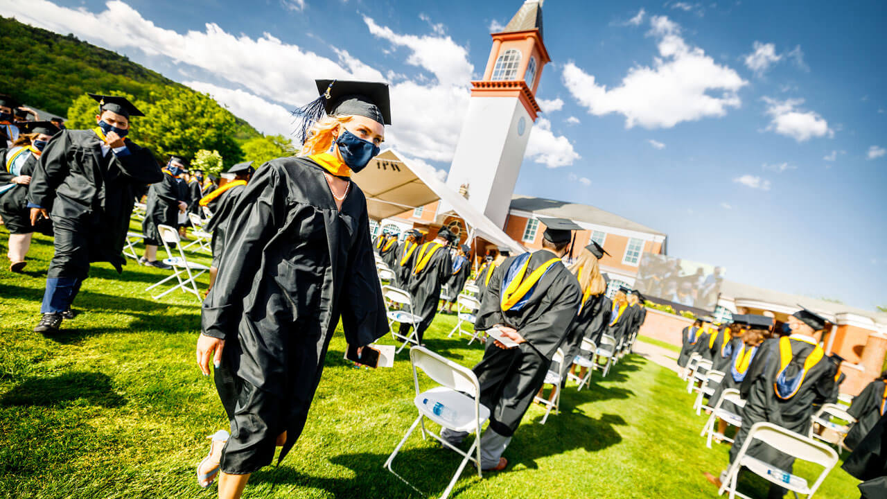 Graduates walking back to their seats