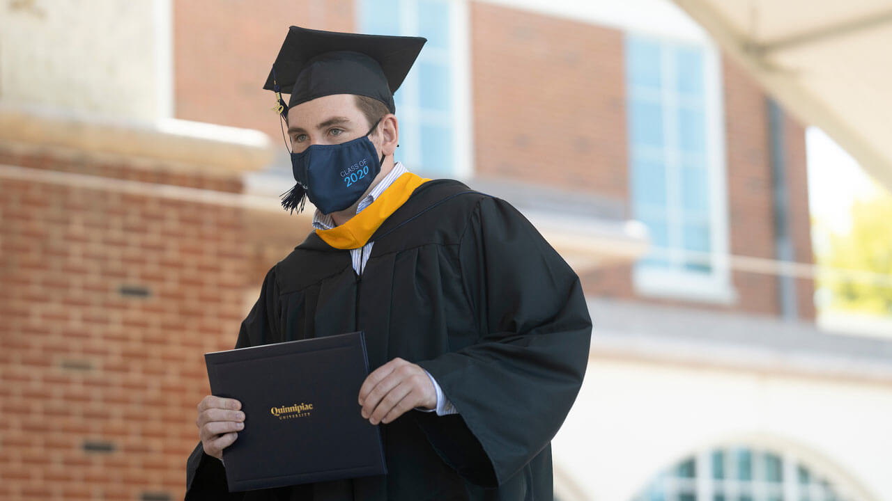 Graduate walking across the stage