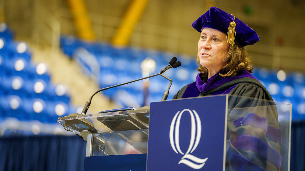 Dean Jennifer Brown speaks at the podium onstage