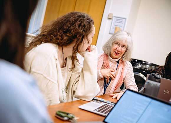 Professor Martha Sanders conducts research with students.