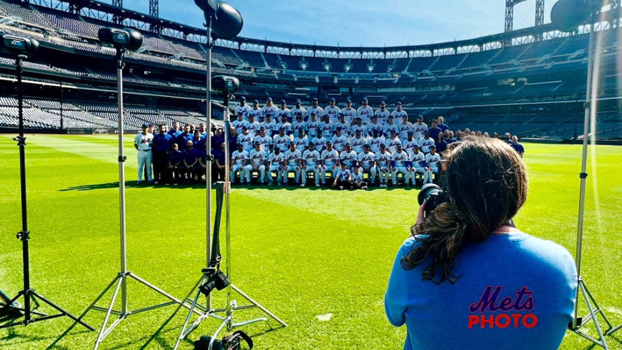 Photographer captures a team photo of a baseball team.