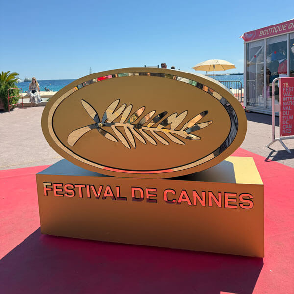 Photo of a gold statue that reads Festival de Cannes.