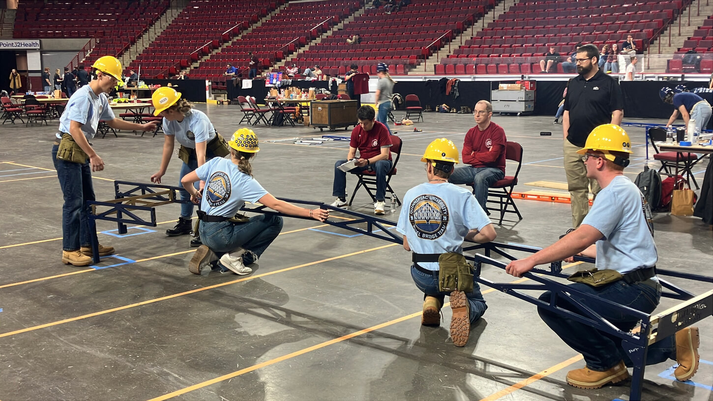 Student participants build their bridge at the 2025 American Society of Civil Engineers (ASCE) Northeast Regional Symposium.