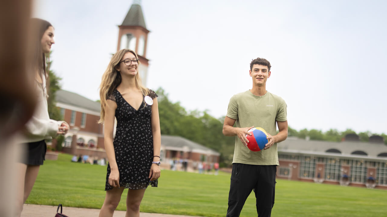 Students hold a beach ball