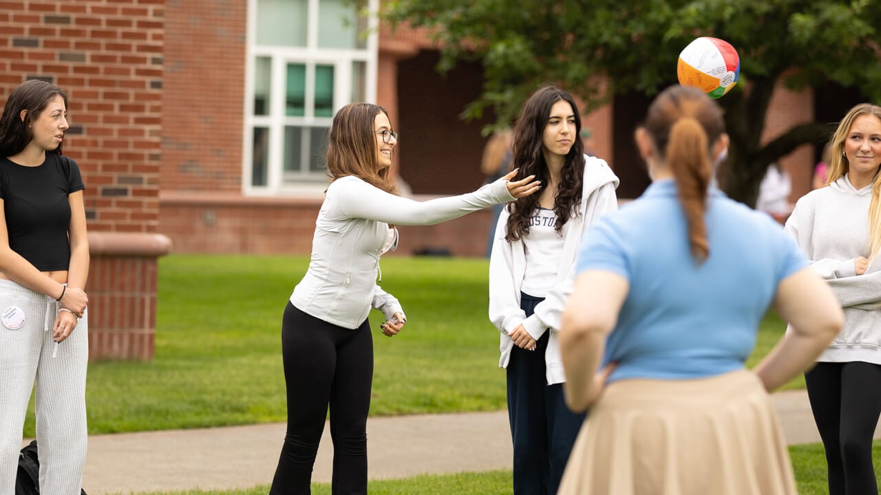 Students toss a beach ball in their orientation groups