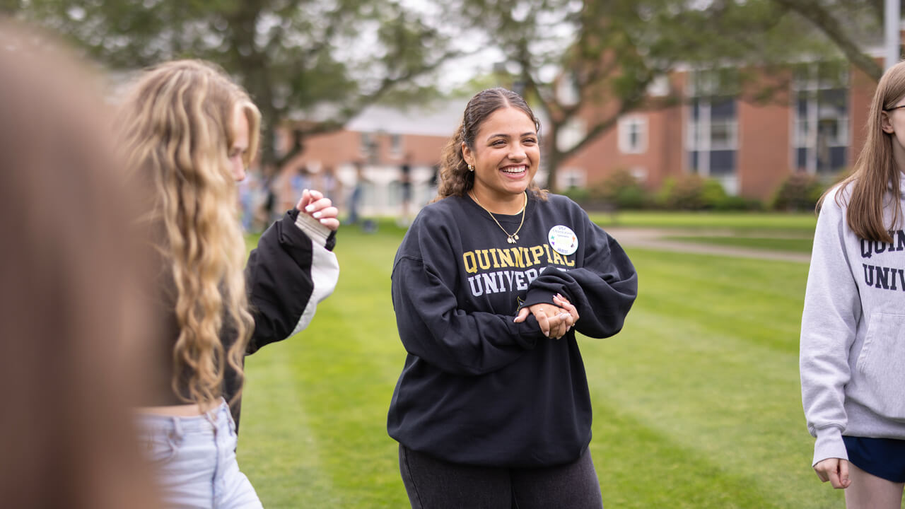 Student smiles in their orientation group